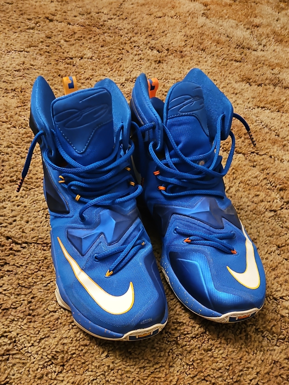 Nike LeBron 13 "Balance" sneakers featuring a vibrant blue upper with orange acc